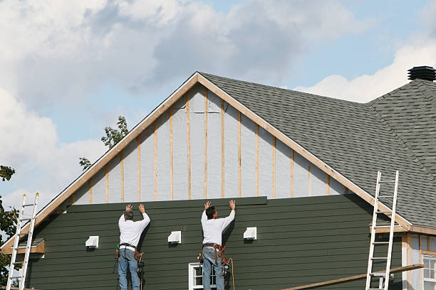 Professional Storm Damage Siding Repair technician working in Crooksville, OH
